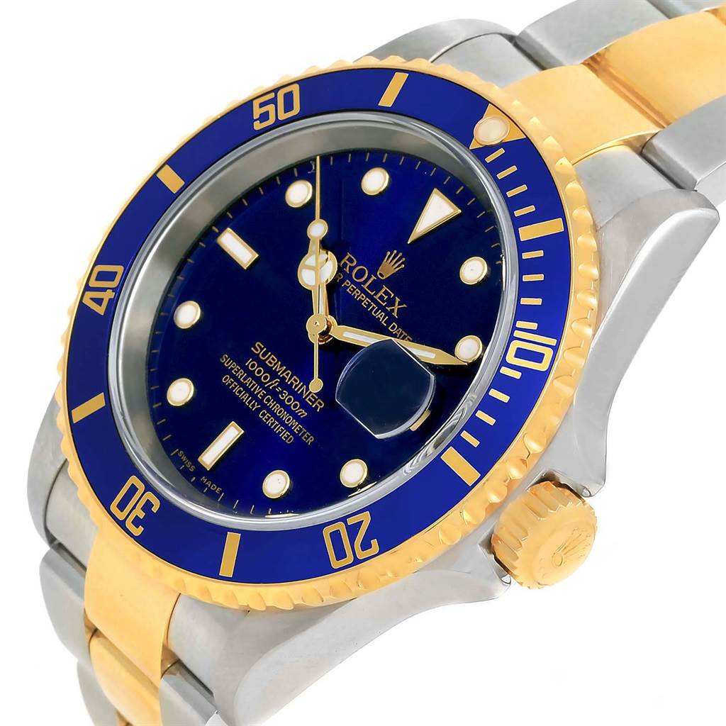 This image shows a Rolex Submariner 16613 Men's Steel and Gold (two tone) Blue Dial 16613 Men's Steel and Gold (two tone) Blue Dial watch at an angle highlighting its blue dial, bezel, and part of the bracelet and crown.
