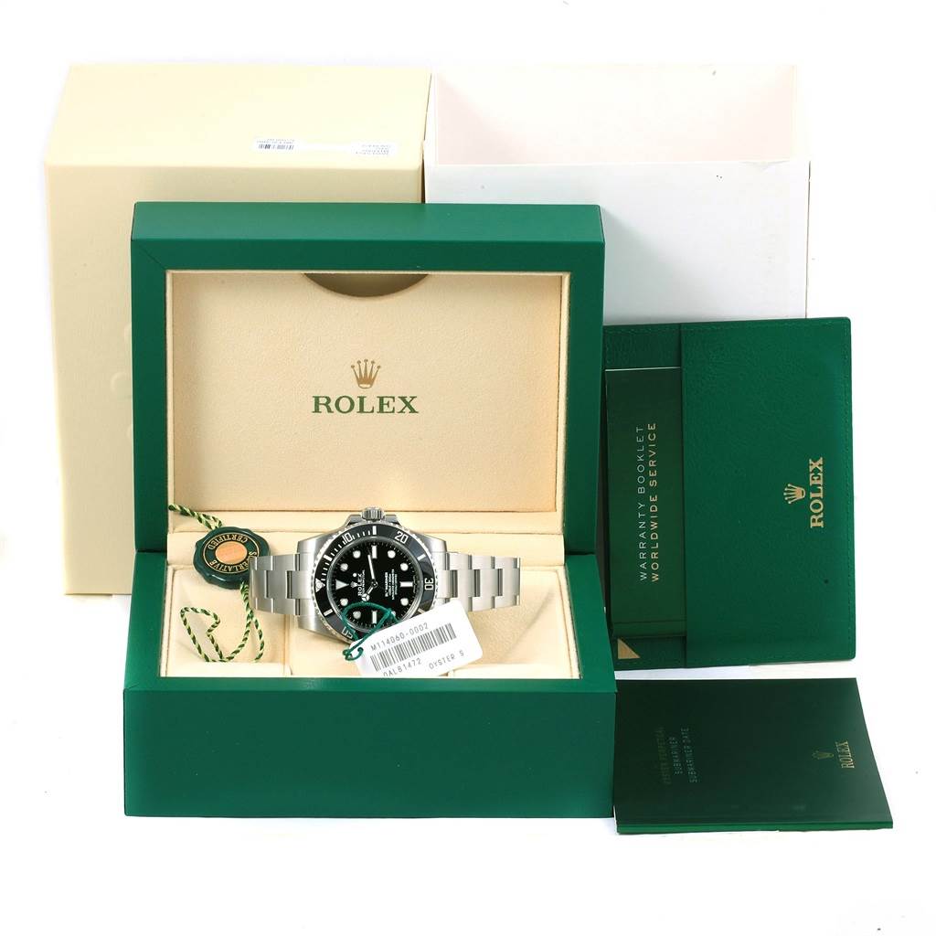 This image shows a Rolex Submariner 114060 Men's Stainless Steel Black Dial 114060 Men's Stainless Steel Black Dial watch with its box, warranty booklet, and tag accessories from a front angle.