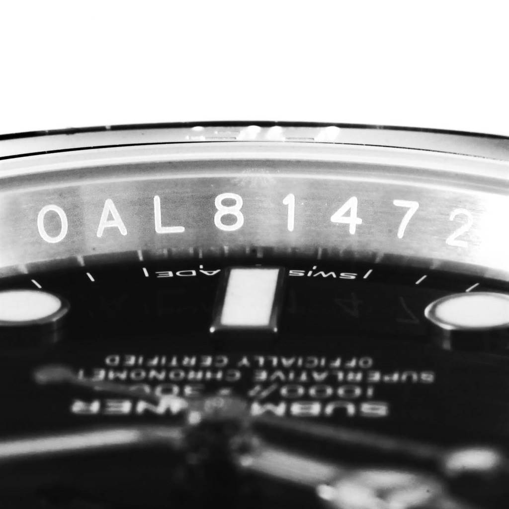 The image shows a close-up of the serial number on the rehaut of a Rolex Submariner 114060 Men's Stainless Steel Black Dial 114060 Men's Stainless Steel Black Dial watch.