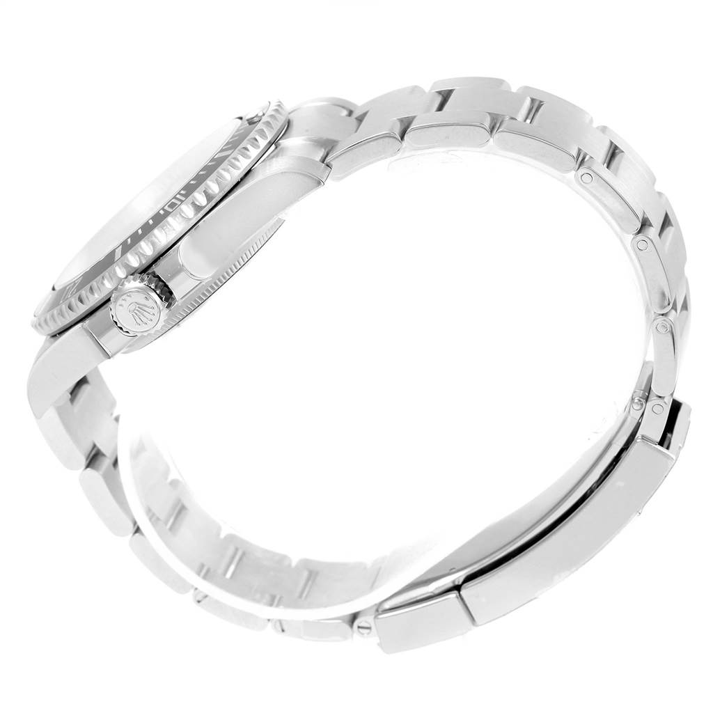 The image shows a side profile of a Rolex Submariner 114060 Men's Stainless Steel Black Dial 114060 Men's Stainless Steel Black Dial, highlighting its crown, bezel, and bracelet.