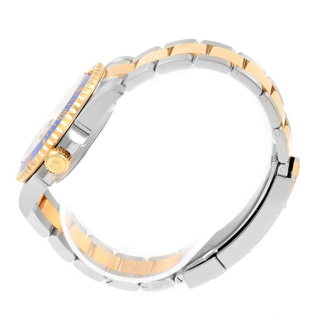 The image shows a side view of the Rolex Submariner 116613 Men's Steel and Gold (two tone) Blue Dial 116613 Men's Steel and Gold (two tone) Blue Dial watch, highlighting the crown, bezel, and bracelet with gold accents.