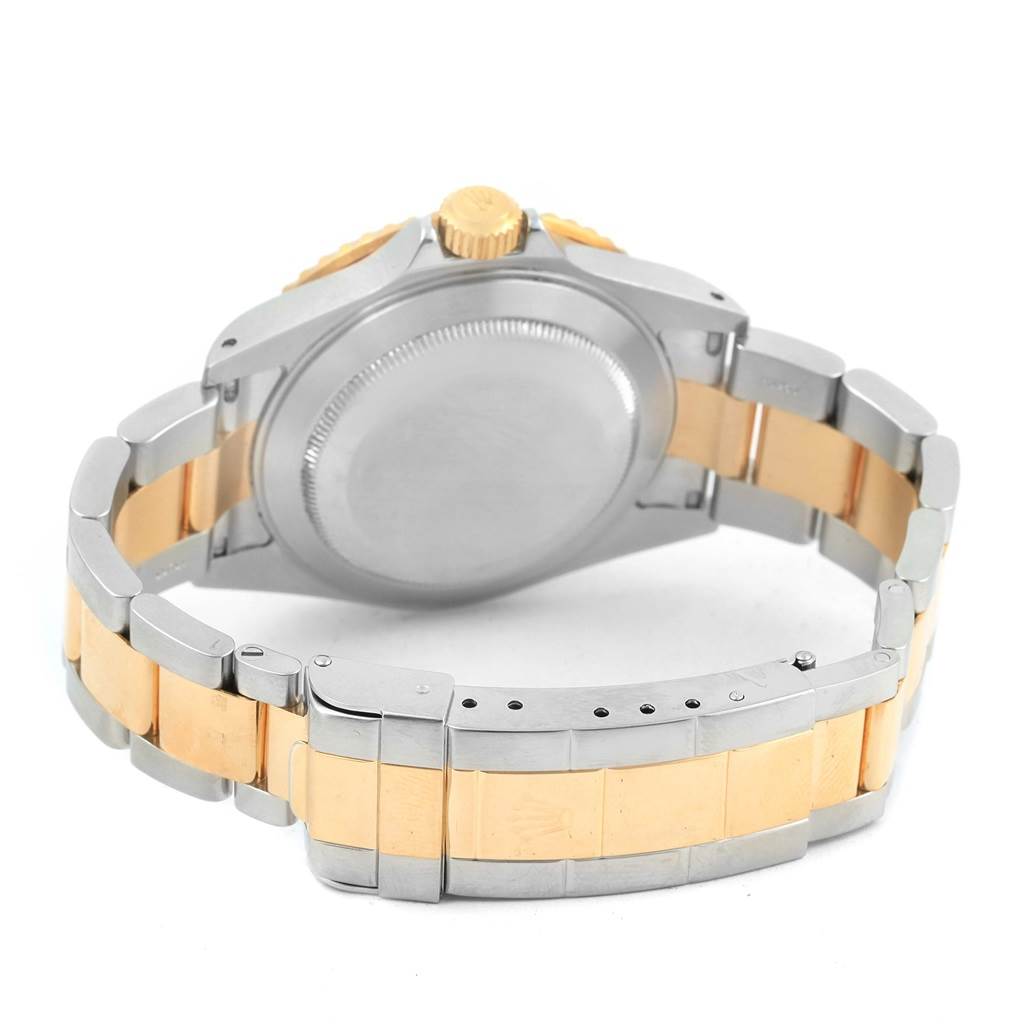 The image shows the case back and bracelet of the Rolex Submariner 16613 Men's Steel and Gold (two tone) Black Dial 16613 Men's Steel and Gold (two tone) Black Dial watch from a rear angle.