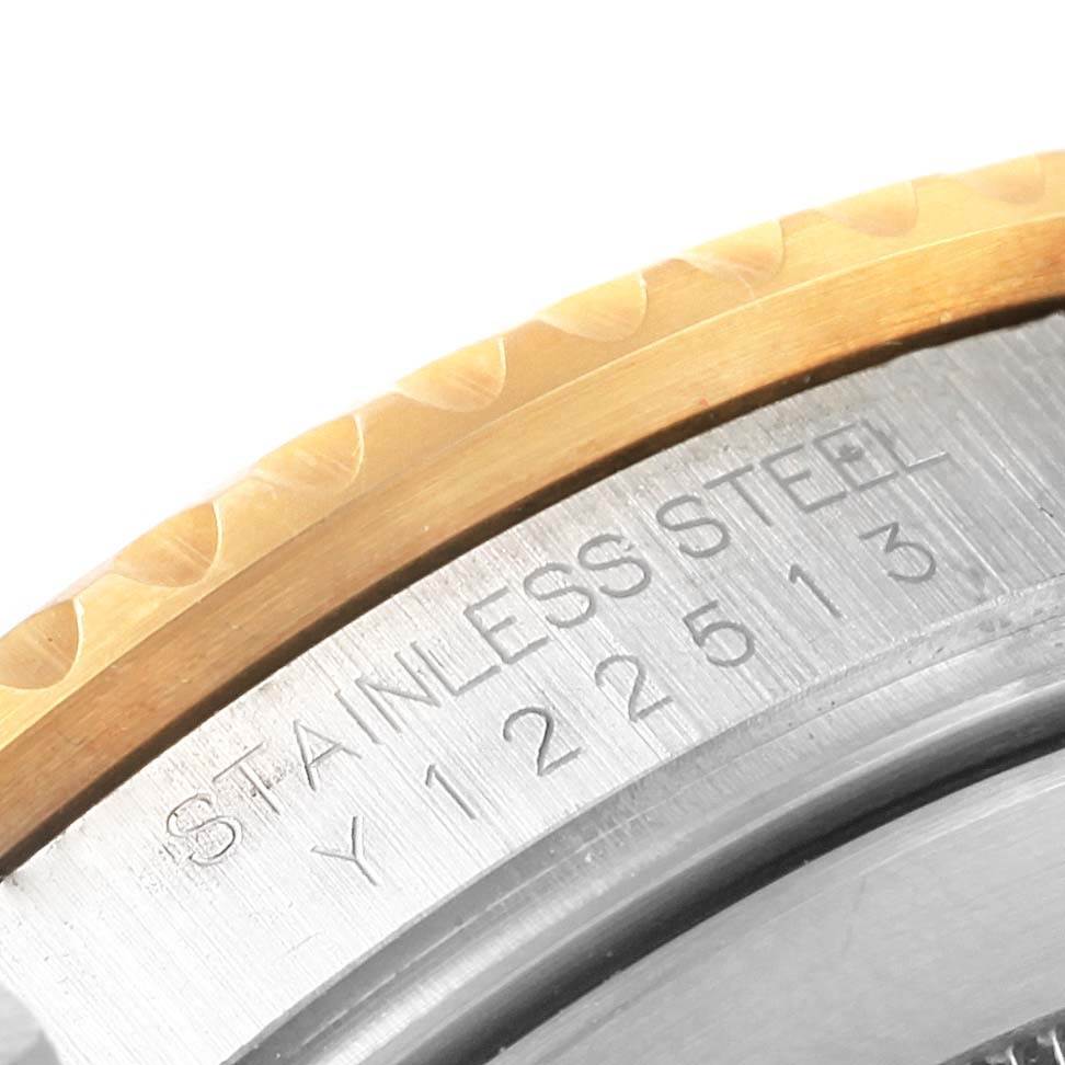 This close-up angle shows part of the stainless steel casing and bezel of the Rolex Submariner 16613 Men's Steel and Gold (two tone) Black Dial 16613 Men's Steel and Gold (two tone) Black Dial watch.