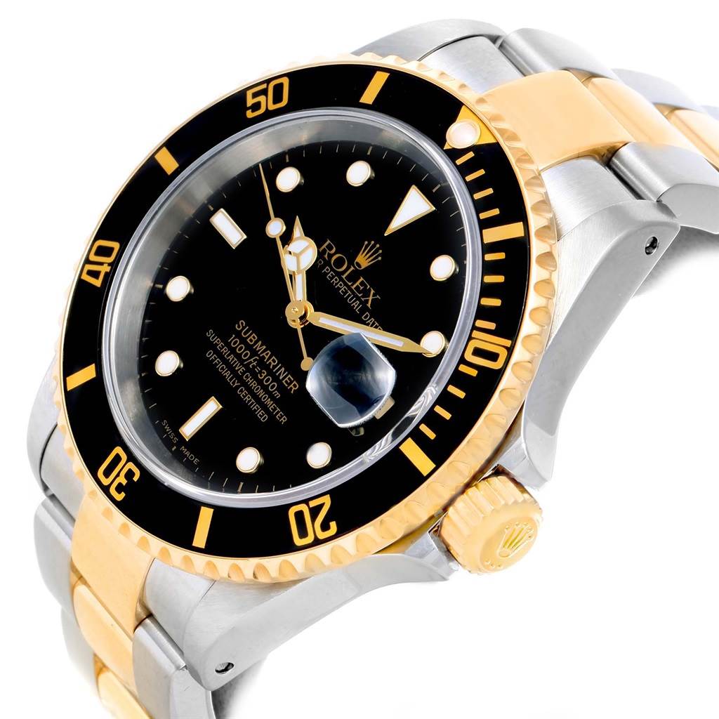 The image shows the dial, bezel, crown, and part of the bracelet of a Rolex Submariner 16613 Men's Steel and Gold (two tone) Black Dial 16613 Men's Steel and Gold (two tone) Black Dial watch from a slightly angled view.