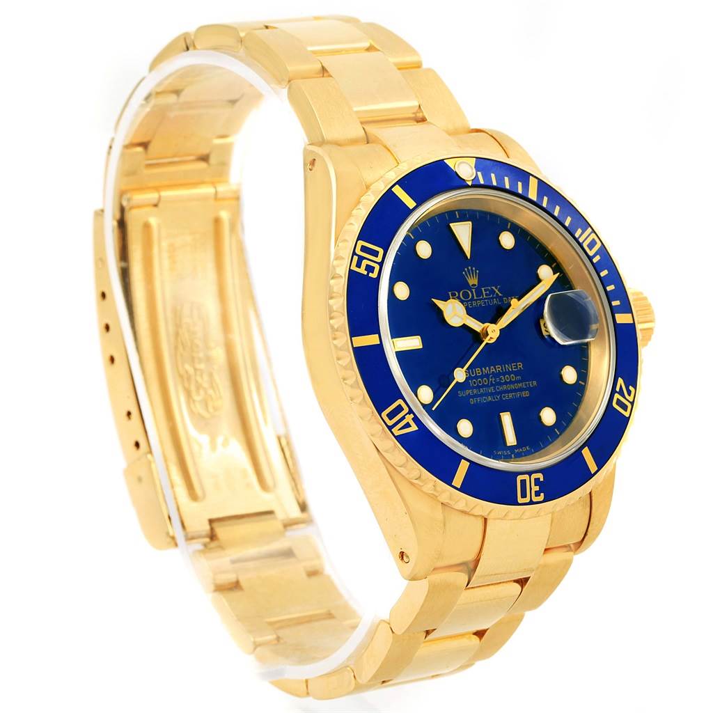 The image shows a side view of a Rolex Submariner 16618 Men's Yellow Gold Blue Dial 16618 Men's Yellow Gold Blue Dial watch, highlighting its blue dial and gold bracelet.
