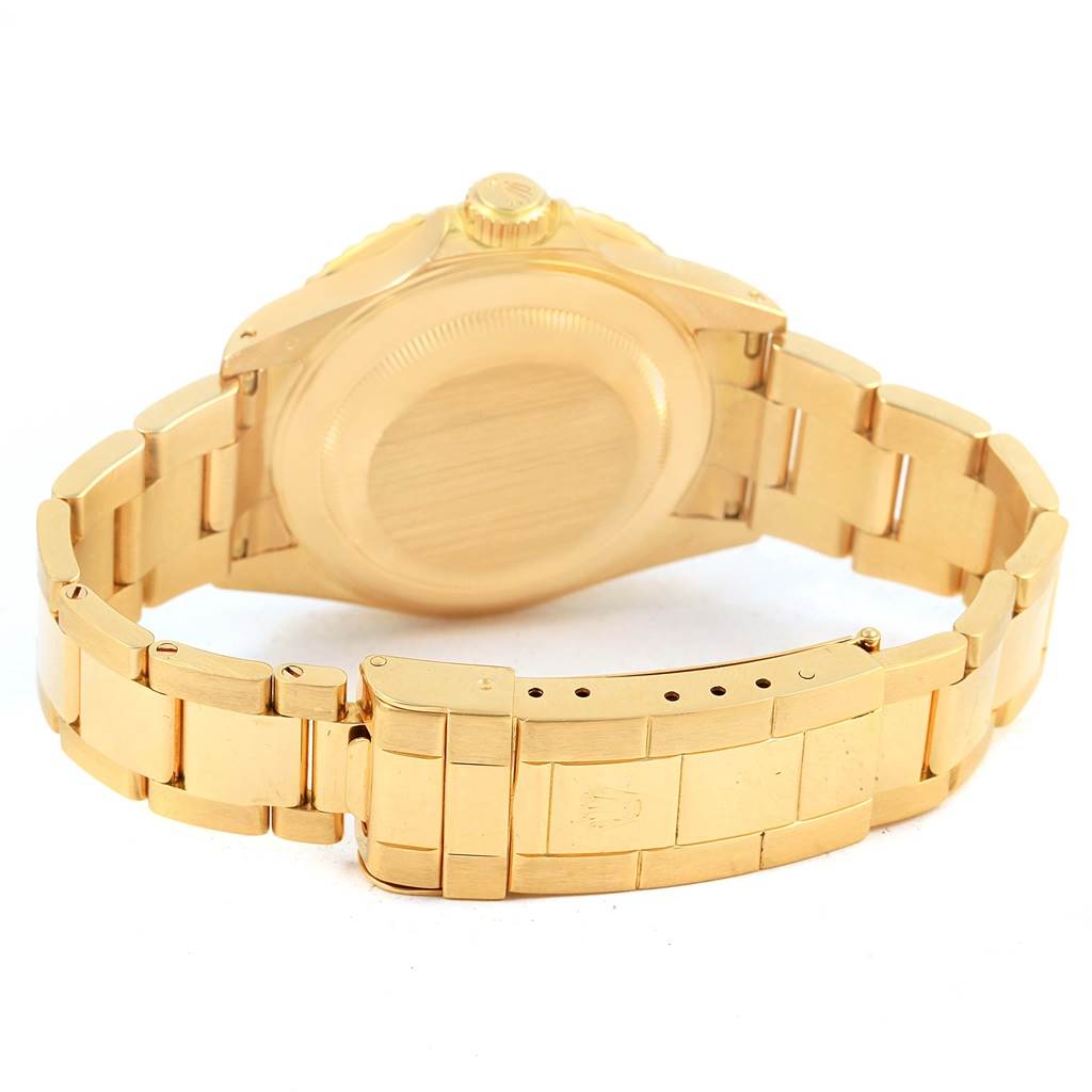 This image shows the back view of a Rolex Submariner 16618 Men's Yellow Gold Blue Dial 16618 Men's Yellow Gold Blue Dial watch, highlighting the case back, bracelet, and clasp.