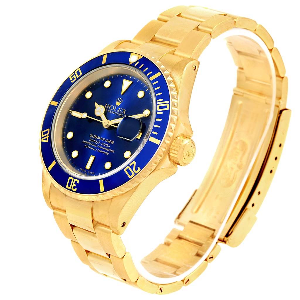 This image shows a side and front angle of a gold Rolex Submariner 16618 Men's Yellow Gold Blue Dial 16618 Men's Yellow Gold Blue Dial watch, highlighting its blue dial, bezel, and bracelet.