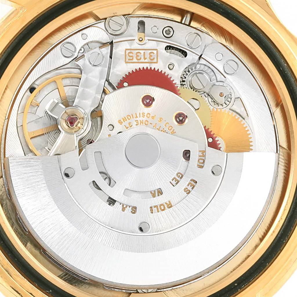 This image shows the rear, internal mechanics of a Rolex Submariner 16618 Men's Yellow Gold Blue Dial 16618 Men's Yellow Gold Blue Dial watch, highlighting its movement components.