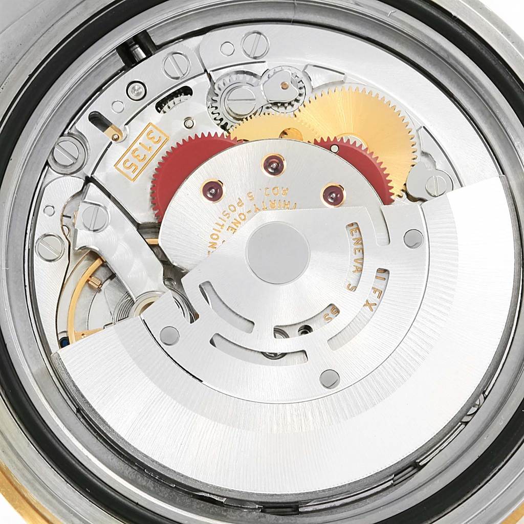 This is a close-up view of the internal mechanical movement of a Rolex Submariner 16613 Men's Steel and Gold (two tone) Blue Dial 16613 Men's Steel and Gold (two tone) Blue Dial watch.