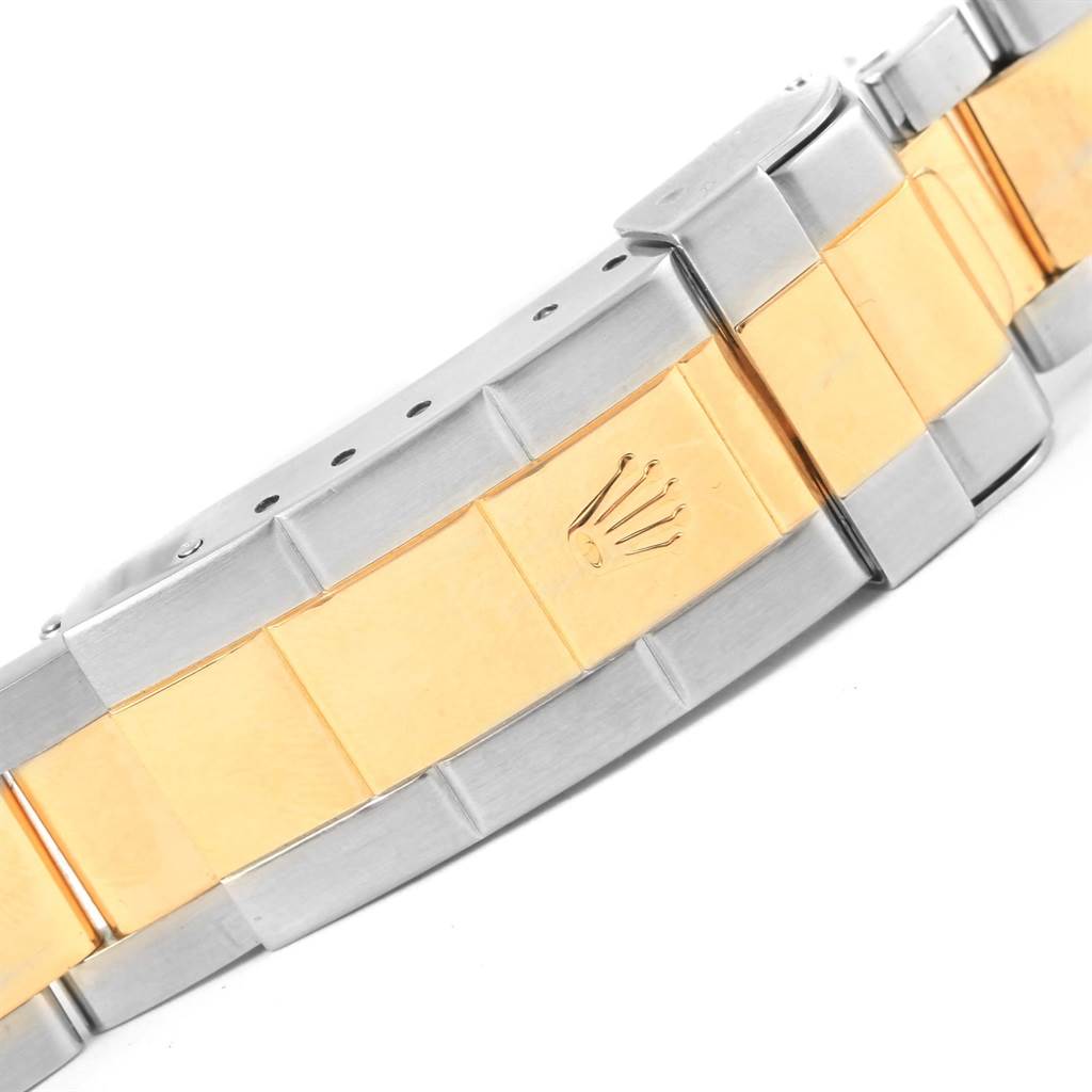 The image shows the clasp portion of a two-tone Rolex Submariner 16613 Men's Steel and Gold (two tone) Blue Dial 16613 Men's Steel and Gold (two tone) Blue Dial bracelet.