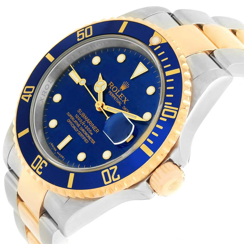 The image shows a close-up angle of the Rolex Submariner 16613 Men's Steel and Gold (two tone) Blue Dial 16613 Men's Steel and Gold (two tone) Blue Dial watch, highlighting the blue dial, bezel, crown, and a portion of the bracelet.