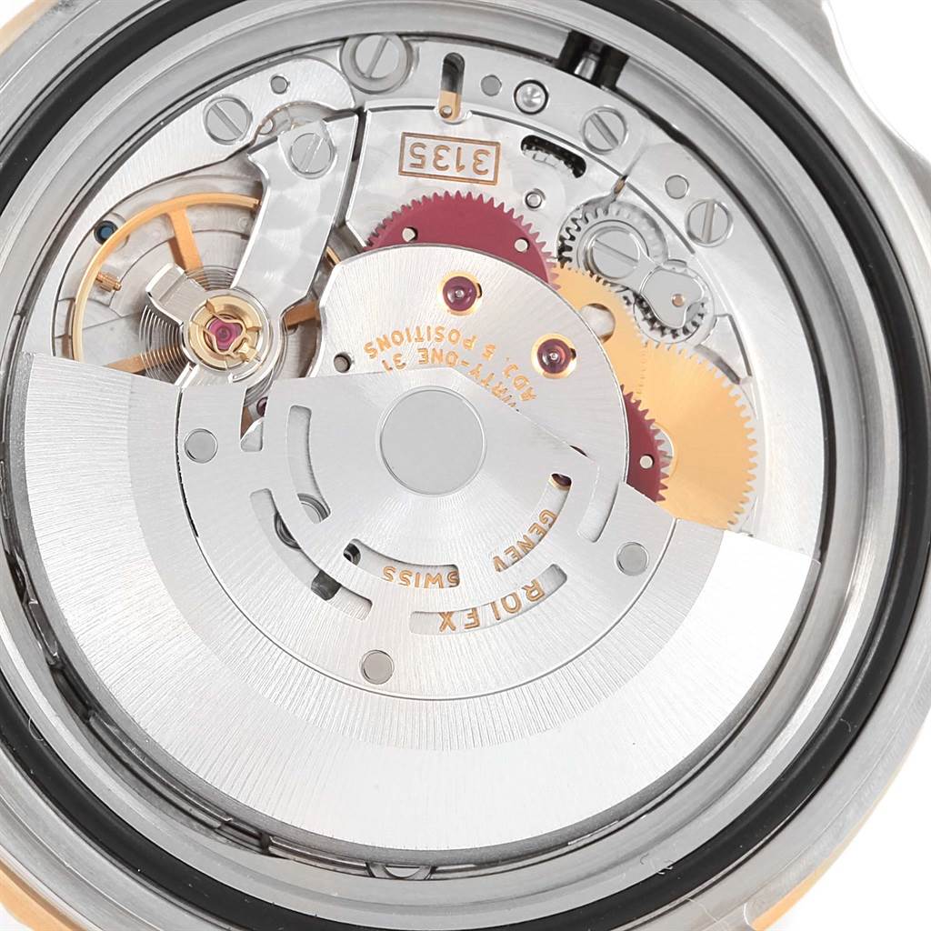 The image shows the internal mechanical movement of a Rolex Submariner 16613 Men
s Steel and Gold (two tone) Black Dial 16613 Men
s Steel and Gold (two tone) Black Dial watch from a back angle.