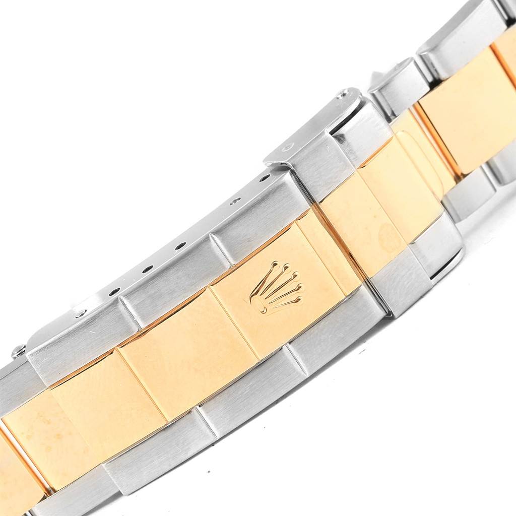 This image shows the bracelet and clasp of a Rolex Submariner 16613 Men
s Steel and Gold (two tone) Black Dial 16613 Men
s Steel and Gold (two tone) Black Dial watch, featuring a mix of gold and stainless steel.