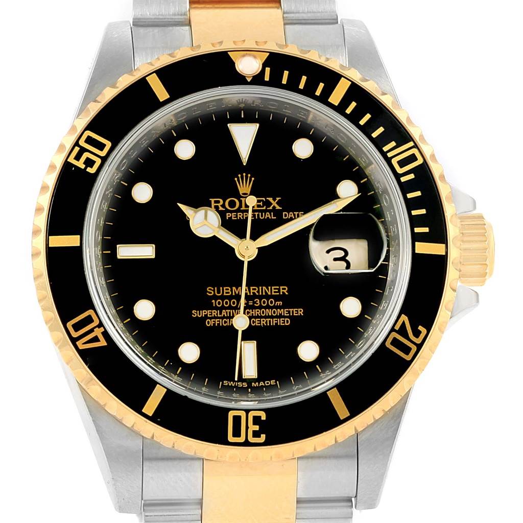 The image shows a front view of a Rolex Submariner 16613 Men
s Steel and Gold (two tone) Black Dial 16613 Men
s Steel and Gold (two tone) Black Dial watch, featuring its bezel, dial, hands, and the date window.