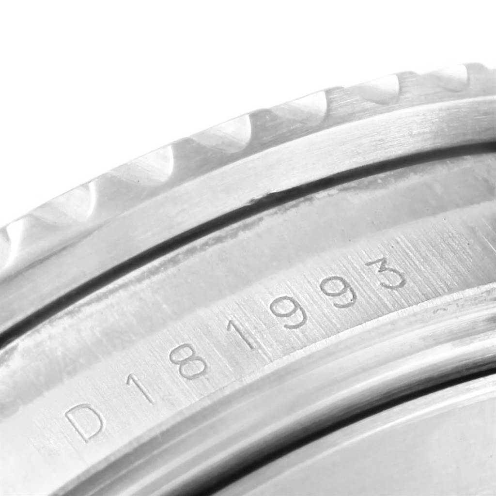 The image shows a close-up of the serial number engraving on the case side of a Rolex Submariner 16610 Men's Stainless Steel Black Dial 16610 Men's Stainless Steel Black Dial watch.