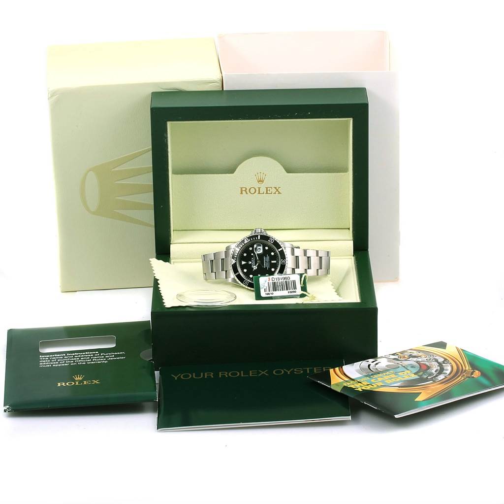 The image shows a Rolex Submariner 16610 Men's Stainless Steel Black Dial 16610 Men's Stainless Steel Black Dial watch in its open box, along with manuals, warranty card, and outer packaging.