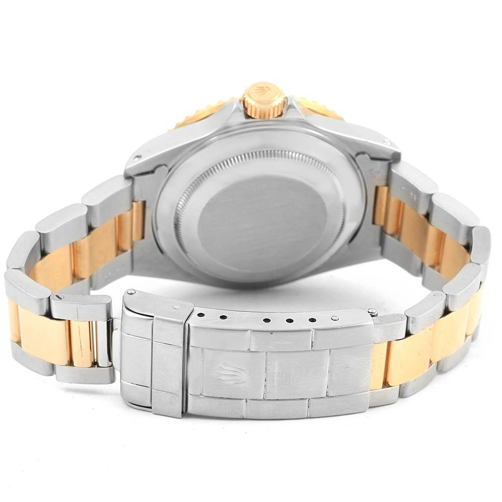 The image shows the back case, clasp, and bracelet of a Rolex Submariner 16613 Men
s Steel and Gold (two tone) Champagne Dial 16613 Men
s Steel and Gold (two tone) Champagne Dial watch from a rear angle.