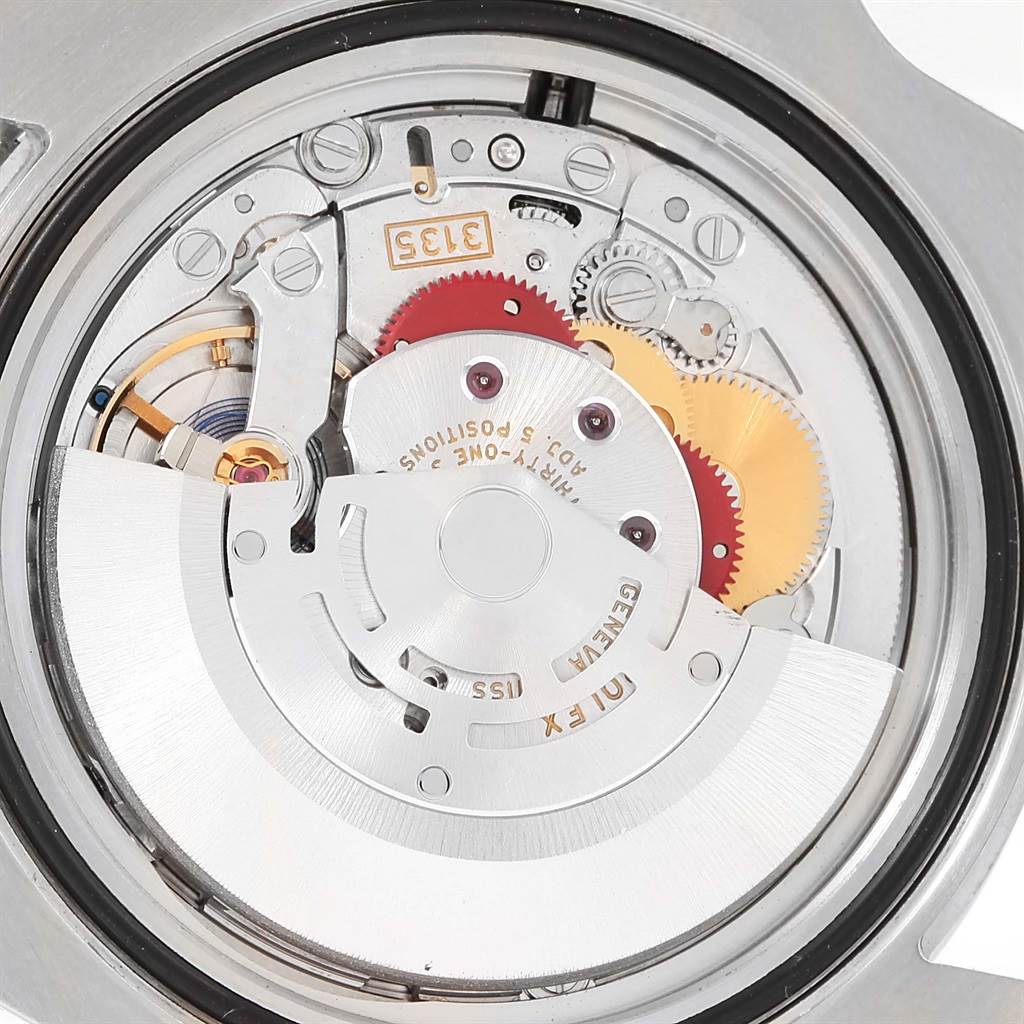The image shows the inner mechanical movement of the Rolex Submariner 116610LV Men
s Stainless Steel Green Dial 116610LV Men
s Stainless Steel Green Dial watch from a close-up angle.