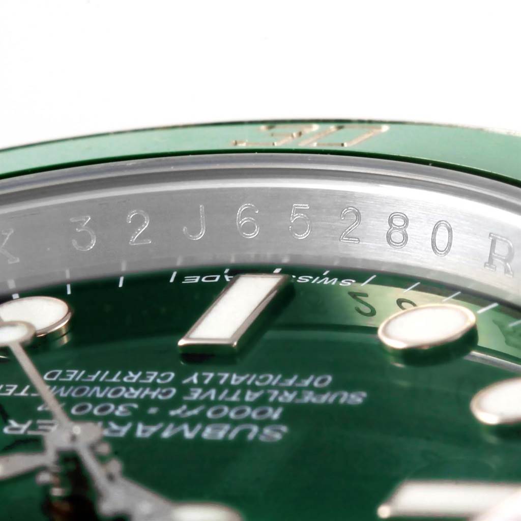 This image shows a close-up of the dial, bezel, and serial number engraving on a Rolex Submariner 116610LV Men
s Stainless Steel Green Dial 116610LV Men
s Stainless Steel Green Dial watch.