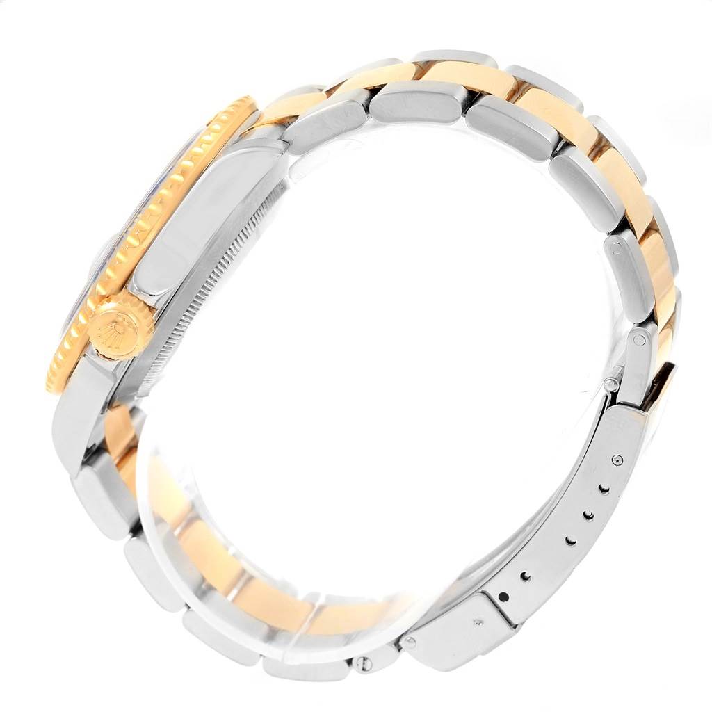 The image shows a side profile of the Rolex Submariner 16613 Men's Steel and Gold (two tone) Blue Dial 16613 Men's Steel and Gold (two tone) Blue Dial watch, focusing on the bracelet and crown.