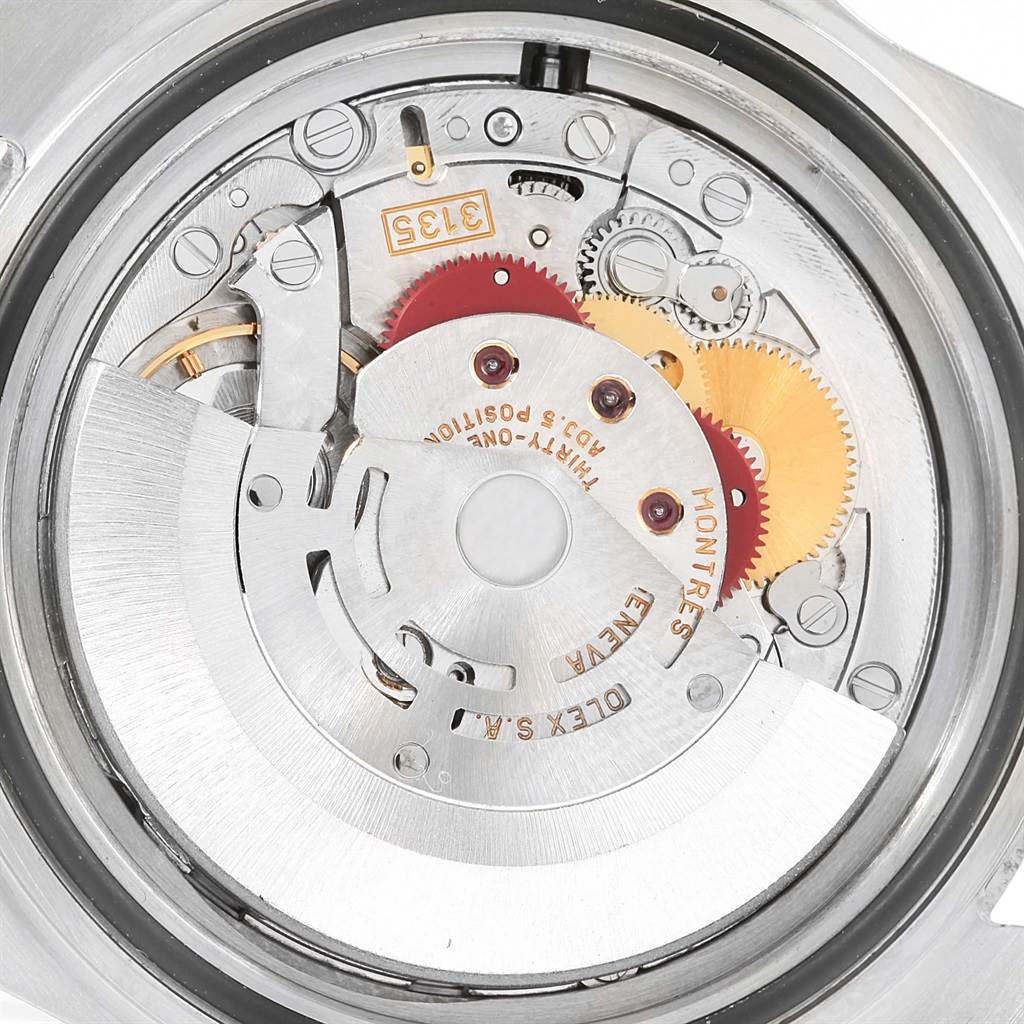 This image shows the internal mechanism and movement details of the Rolex Submariner 16613 Men's Steel and Gold (two tone) Blue Dial 16613 Men's Steel and Gold (two tone) Blue Dial watch, viewed from the back.