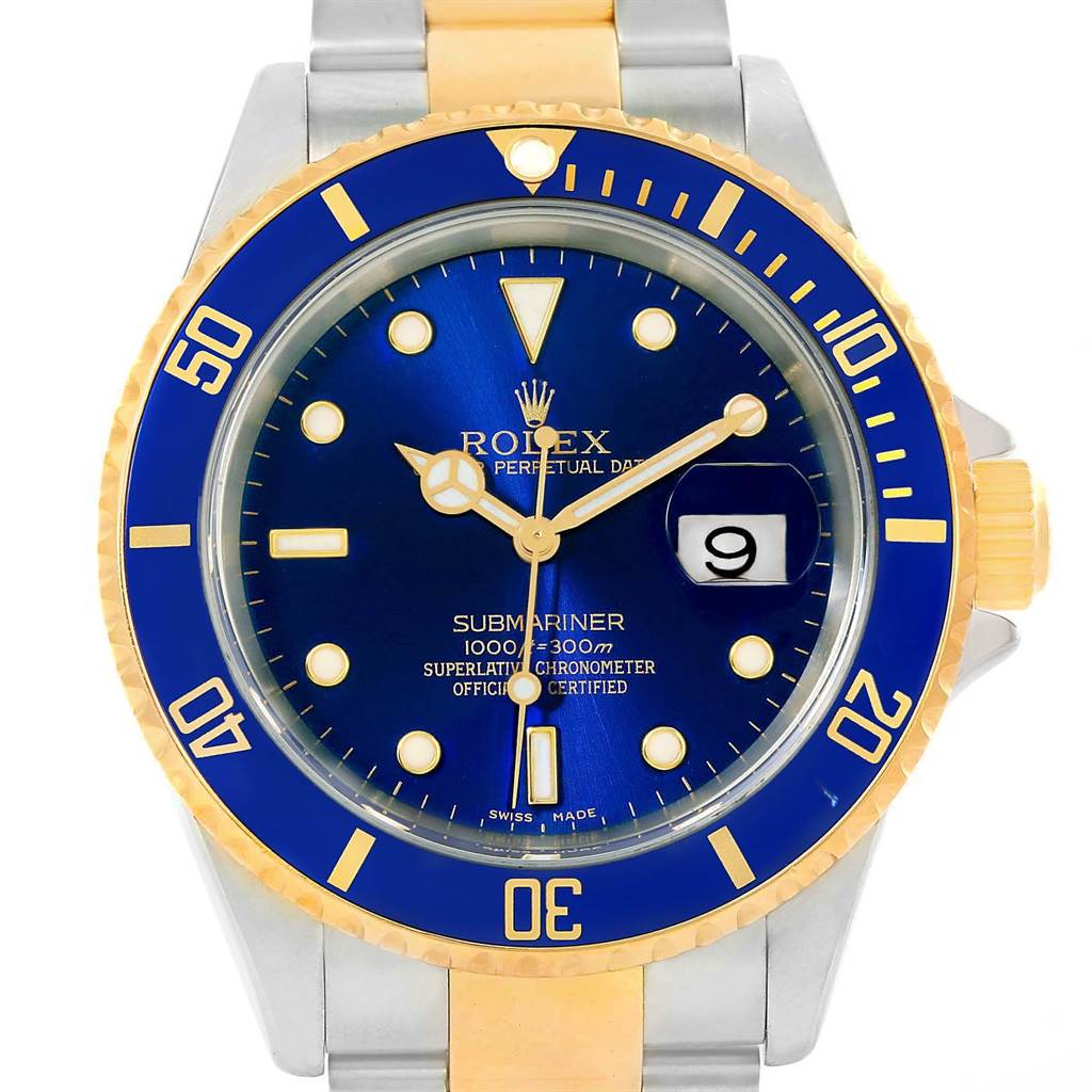 The image shows a front view of a Rolex Submariner 16613 Men's Steel and Gold (two tone) Blue Dial 16613 Men's Steel and Gold (two tone) Blue Dial watch, featuring a blue dial, date window, and a two-tone metal bracelet.