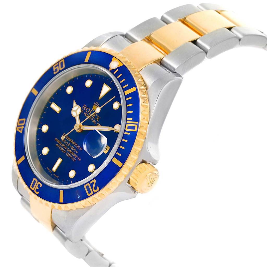 The image shows a side-angle view of a Rolex Submariner 16613 Men's Steel and Gold (two tone) Blue Dial 16613 Men's Steel and Gold (two tone) Blue Dial watch, highlighting the blue dial, bezel, and two-tone bracelet.