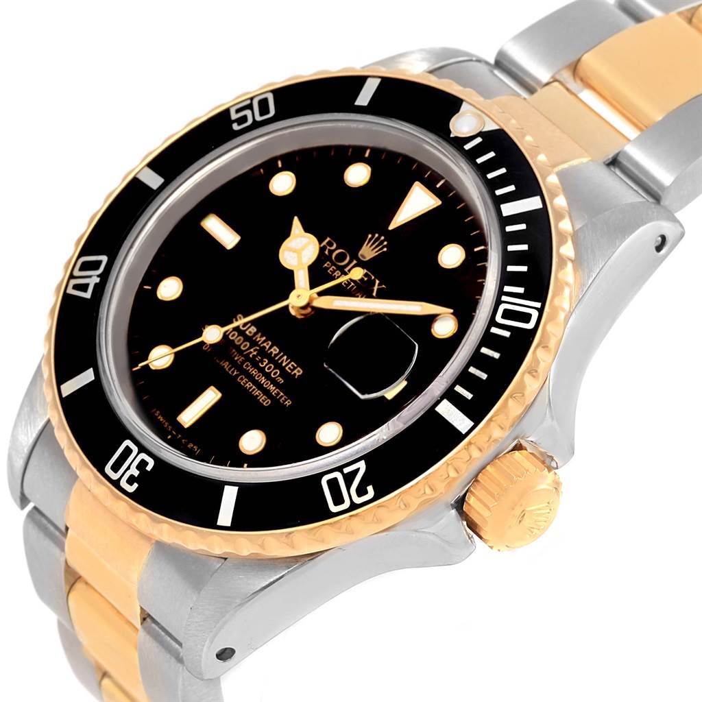 The image shows a close-up of a Rolex Submariner 16803 Men's Steel and Gold (two tone) Black Dial 16803 Men's Steel and Gold (two tone) Black Dial, highlighting the bezel, crown, and part of the bracelet at a slight angle.