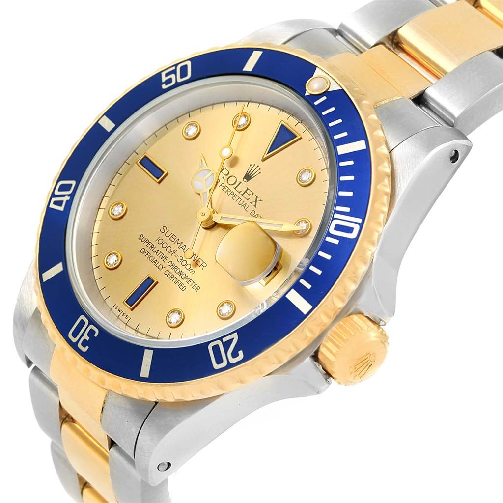 This image shows a close-up angled view of a Rolex Submariner 16613 Men's Steel and Gold (two tone) Champagne Dial 16613 Men's Steel and Gold (two tone) Champagne Dial watch, highlighting its dial, bezel, crown, and bracelet.