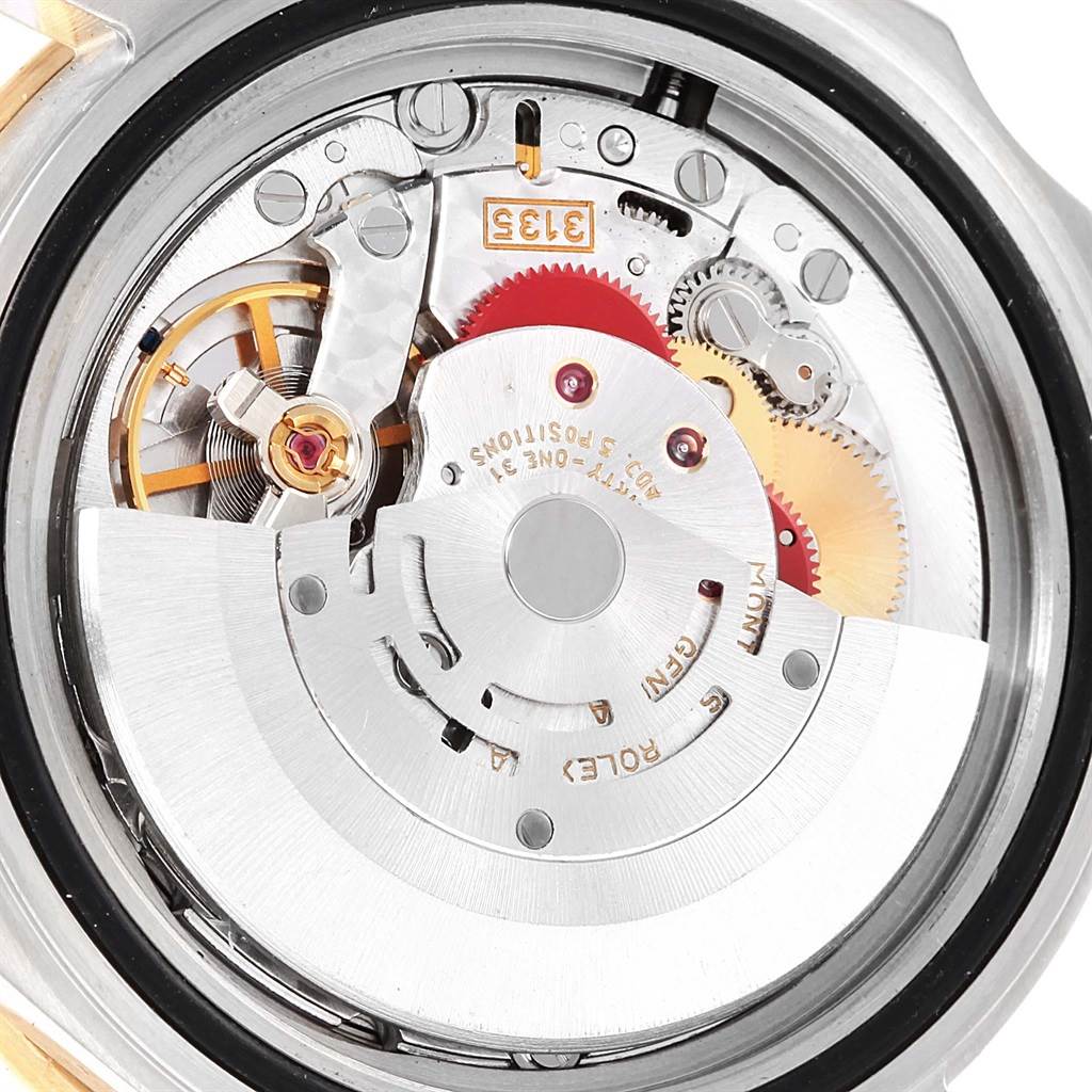 The image shows the internal mechanical movement of a Rolex Submariner 16613 Men's Steel and Gold (two tone) Champagne Dial 16613 Men's Steel and Gold (two tone) Champagne Dial watch from a close-up angle.