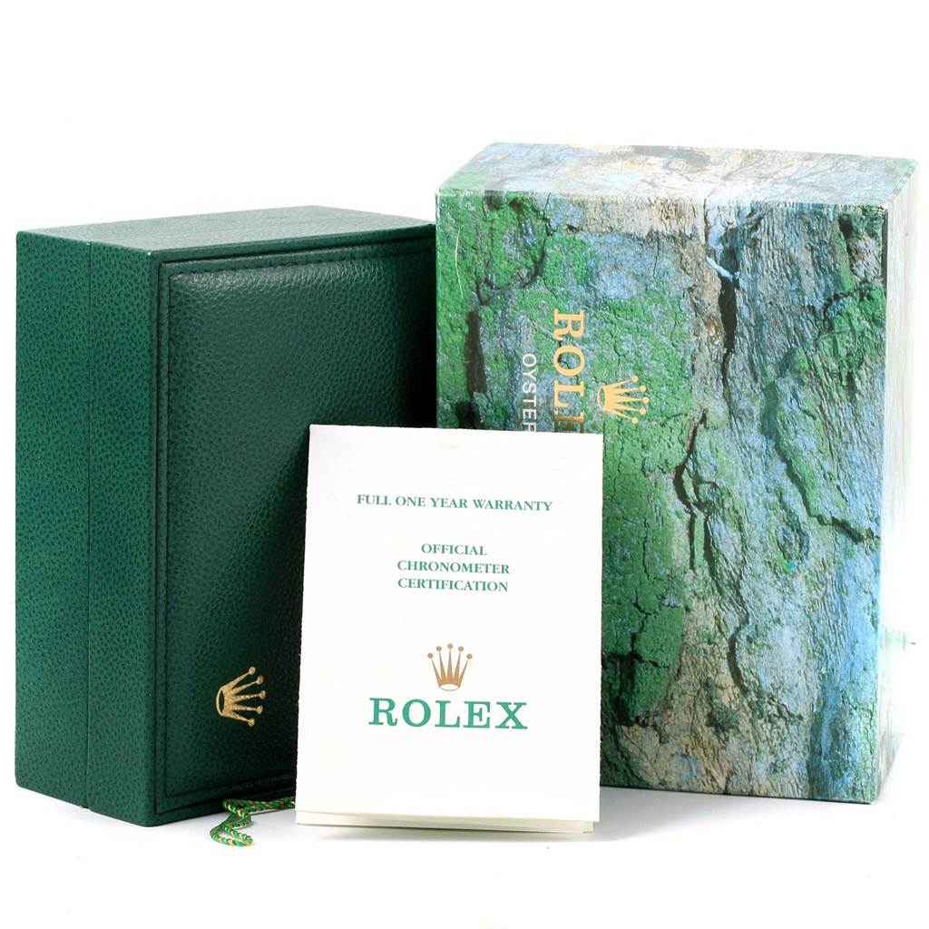 The image shows the green Rolex Submariner 16613 Men's Steel and Gold (two tone) Champagne Dial 16613 Men's Steel and Gold (two tone) Champagne Dial box, a warranty card, and an outer sleeve.
