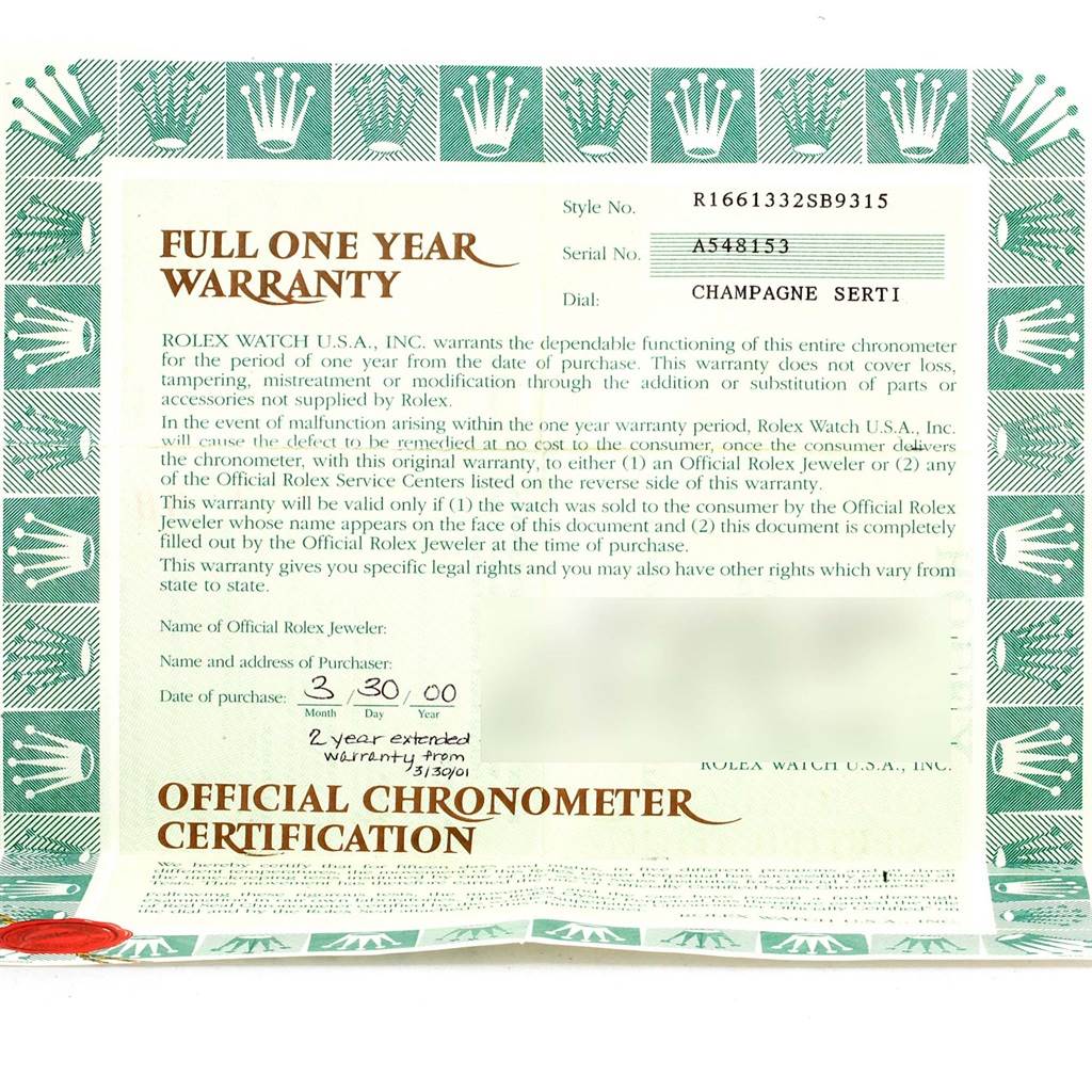 The image shows a close-up of a full one-year warranty certificate for the Rolex Submariner 16613 Men's Steel and Gold (two tone) Champagne Dial 16613 Men's Steel and Gold (two tone) Champagne Dial watch.