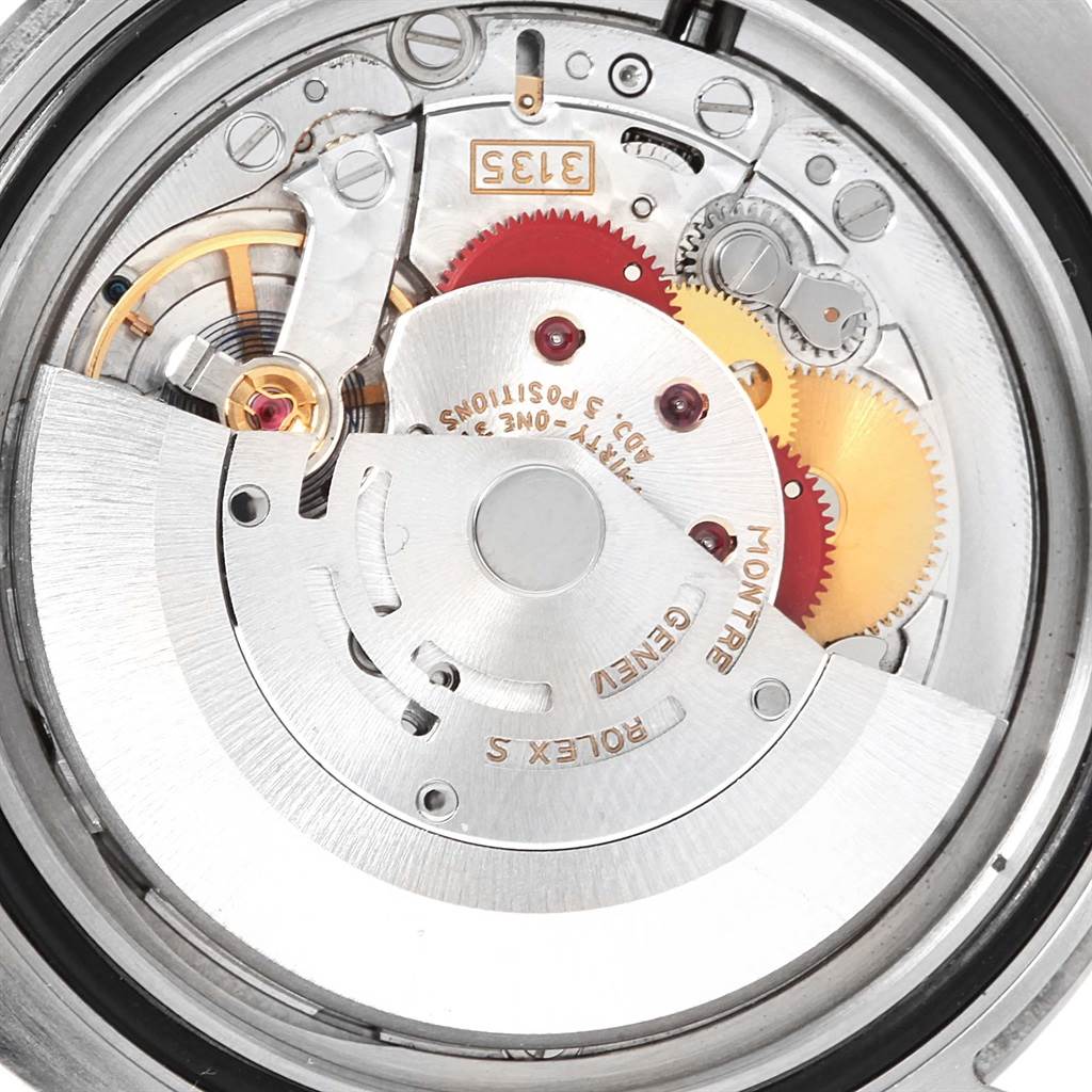 The image shows a close-up view of the movement parts and inner mechanisms of a Rolex Submariner 116610 Men's Stainless Steel Black Dial 116610 Men's Stainless Steel Black Dial watch.