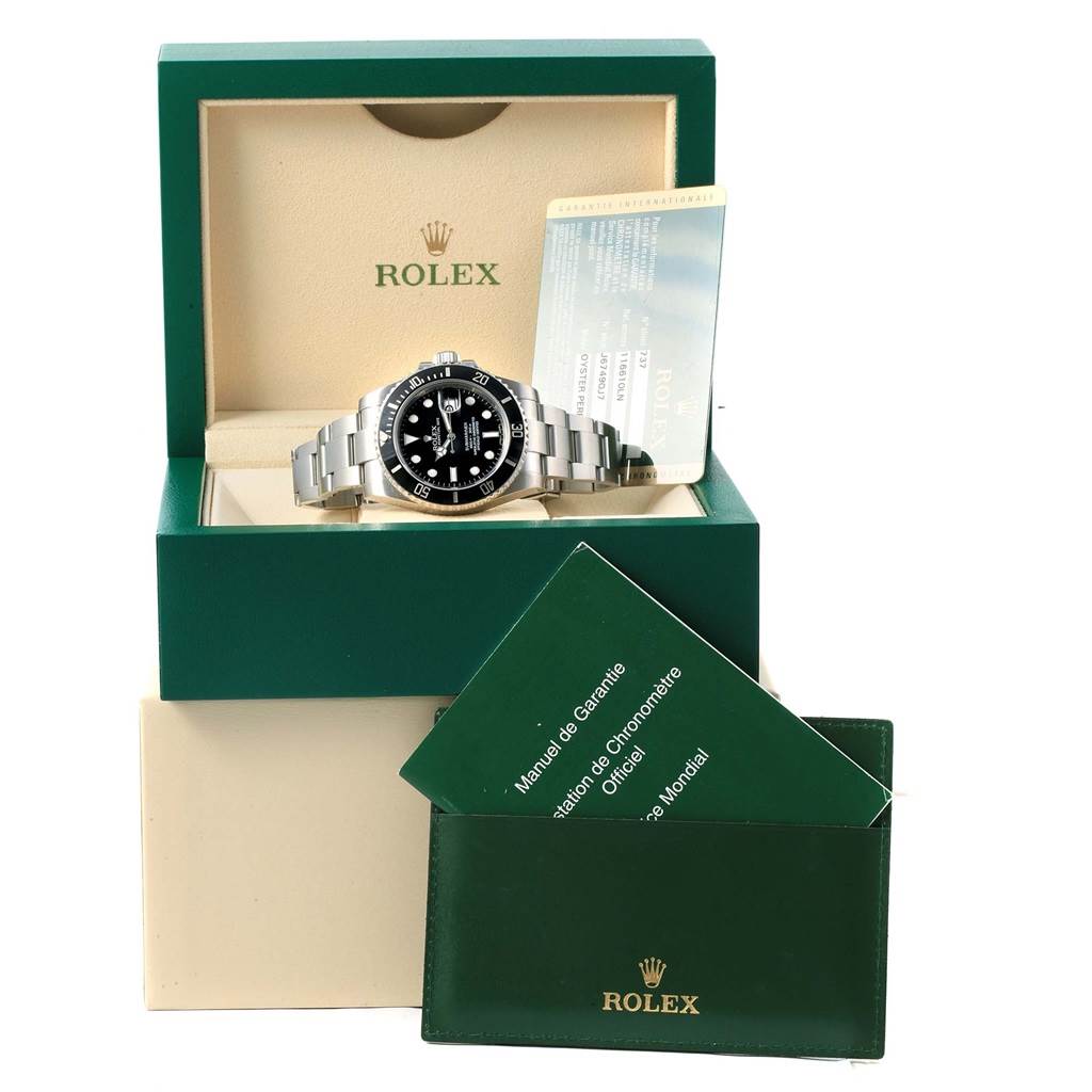 The Rolex Submariner 116610 Men's Stainless Steel Black Dial 116610 Men's Stainless Steel Black Dial watch is shown in an open box with its warranty card and manual visible.
