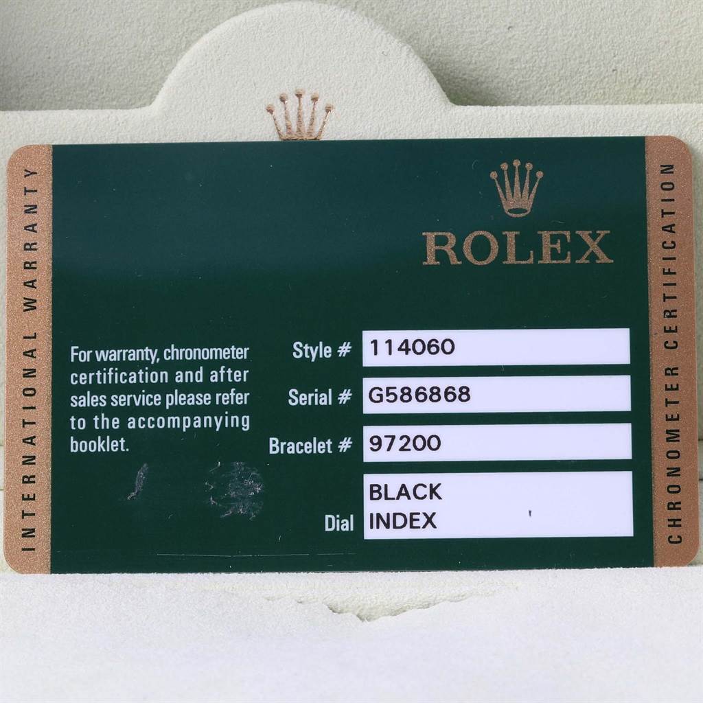 The image shows the warranty card for the Rolex Submariner 114060 Men's Stainless Steel Black Dial 114060 Men's Stainless Steel Black Dial model with details such as style, serial, and bracelet numbers.