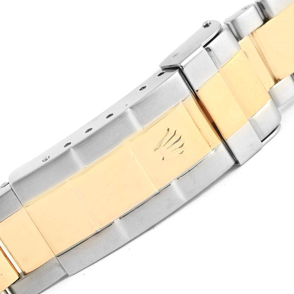 This image shows a close-up of the bracelet and clasp of a Rolex Submariner 16613 Men
s Steel and Gold (two tone) Black Dial 16613 Men
s Steel and Gold (two tone) Black Dial, featuring two-tone metal links.