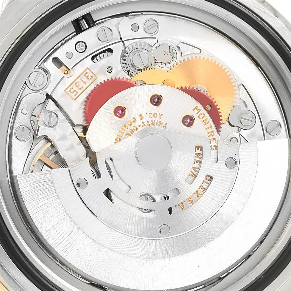 This image shows a close-up view of the movement inside a Rolex Submariner 16613 Men
s Steel and Gold (two tone) Black Dial 16613 Men
s Steel and Gold (two tone) Black Dial watch.