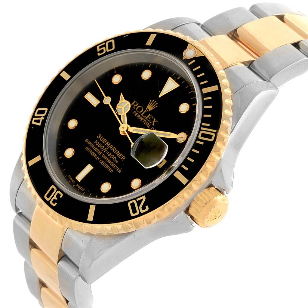 The image shows a side angle of a Rolex Submariner 16613 Men
s Steel and Gold (two tone) Black Dial 16613 Men
s Steel and Gold (two tone) Black Dial watch, highlighting the bezel, dial, crown, and part of the bracelet.