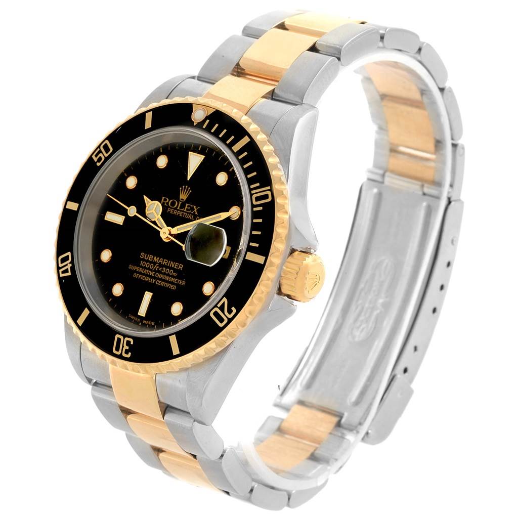 This image shows a Rolex Submariner 16613 Men
s Steel and Gold (two tone) Black Dial 16613 Men
s Steel and Gold (two tone) Black Dial watch at a three-quarter angle, highlighting its black dial, bezel, and two-tone gold and silver bracelet.