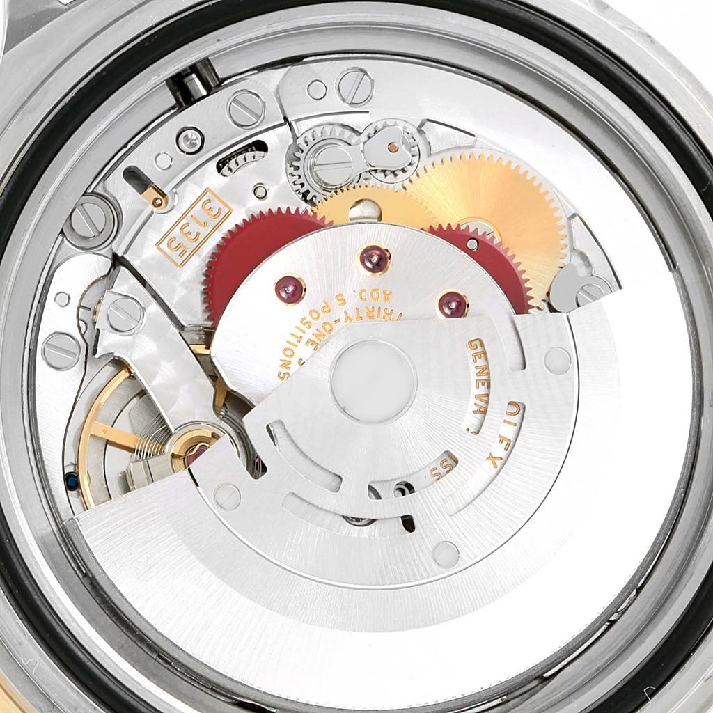 This image shows the internal mechanical movement of a Rolex Submariner 16613 Men's Steel and Gold (two tone) Blue Dial 16613 Men's Steel and Gold (two tone) Blue Dial watch from a close-up angle.