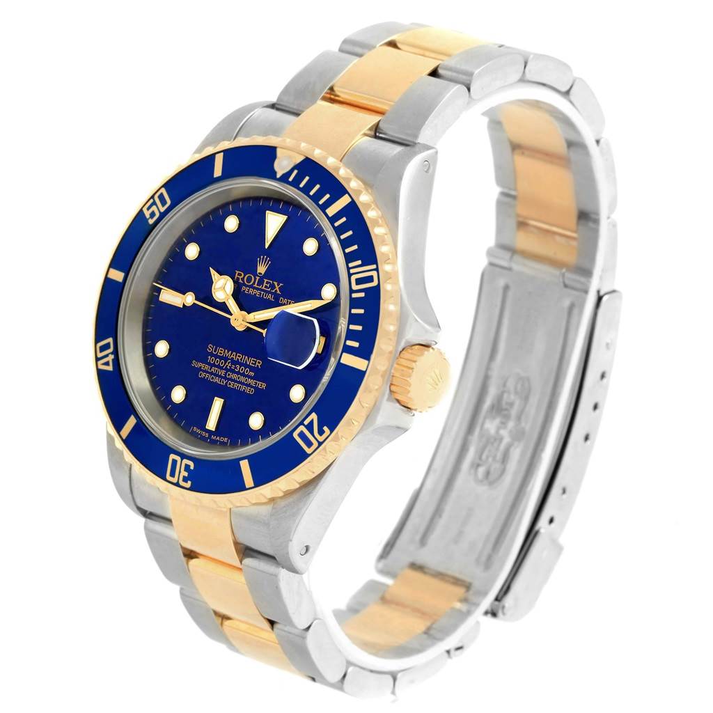 This image shows a Rolex Submariner 16613 Men's Steel and Gold (two tone) Blue Dial 16613 Men's Steel and Gold (two tone) Blue Dial watch at a three-quarter view highlighting its bezel, dial, crown, and two-tone bracelet.