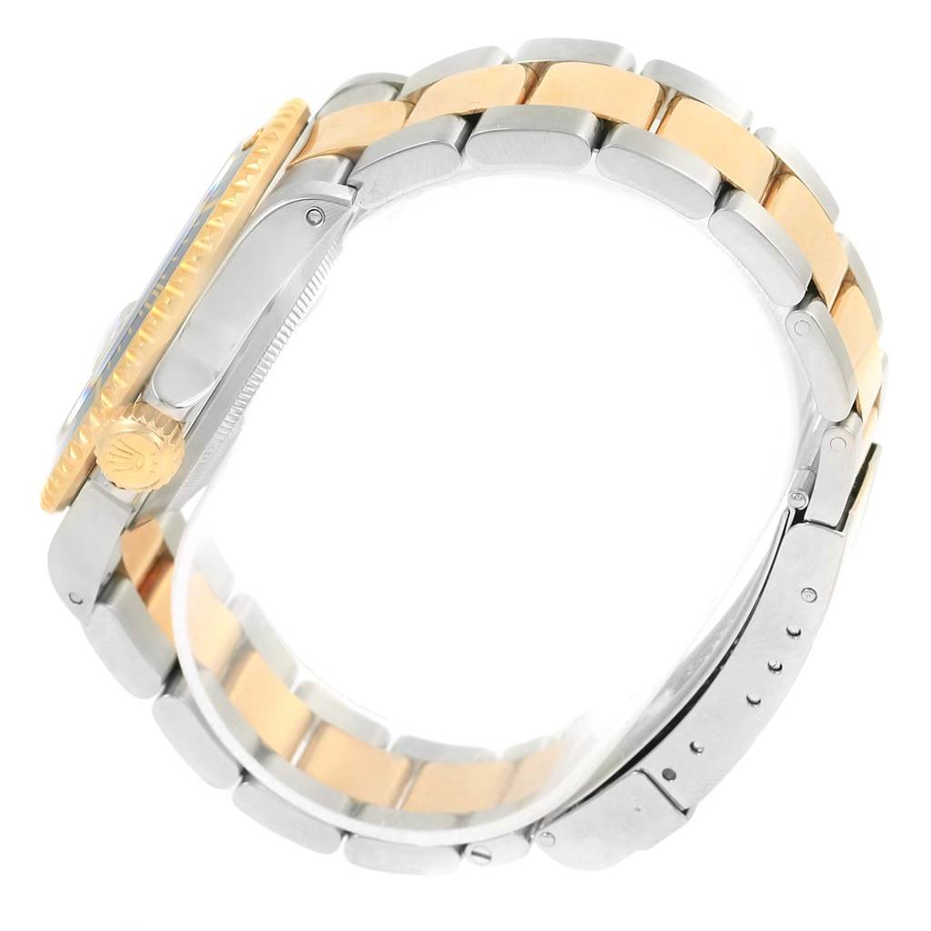 The image shows a side view of the Rolex Submariner 16613 Men's Steel and Gold (two tone) Blue Dial 16613 Men's Steel and Gold (two tone) Blue Dial, highlighting its two-tone bracelet and crown.