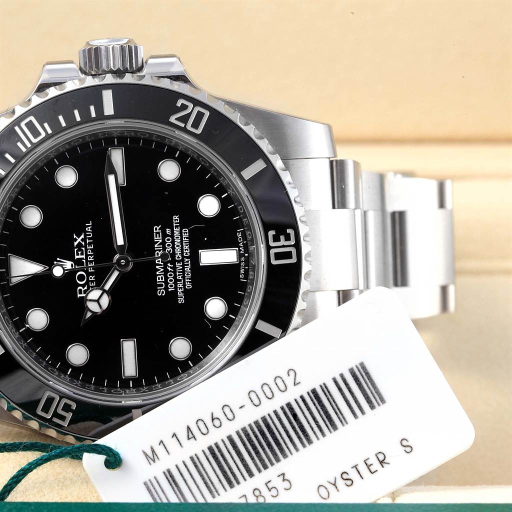 The image shows a Rolex Submariner 114060 Men's Stainless Steel Black Dial 114060 Men's Stainless Steel Black Dial watch from an angled view, highlighting the dial, bezel, crown, and bracelet.