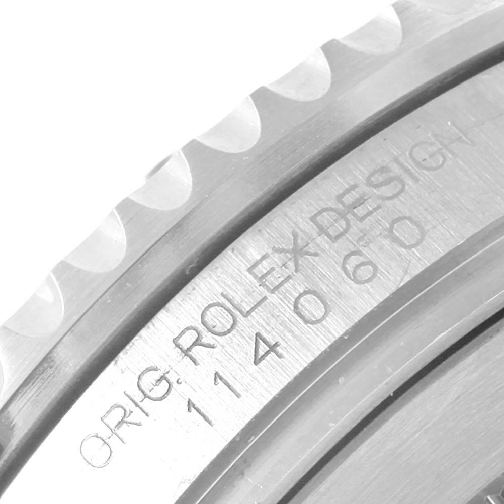 This close-up angle shows the engraved inner bezel of a Rolex Submariner 114060 Men's Stainless Steel Black Dial 114060 Men's Stainless Steel Black Dial watch, highlighting the model and brand details.