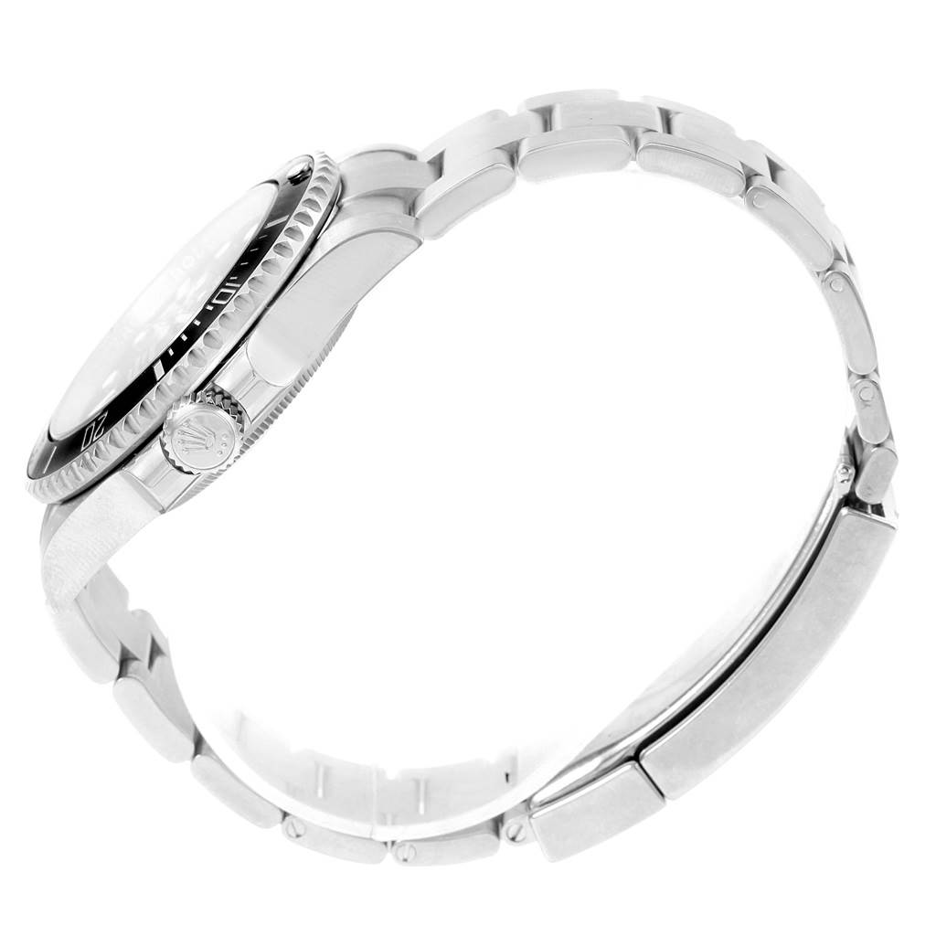 The image shows a side view of the Rolex Submariner 114060 Men's Stainless Steel Black Dial 114060 Men's Stainless Steel Black Dial, highlighting its crown, bezel, and metal bracelet.