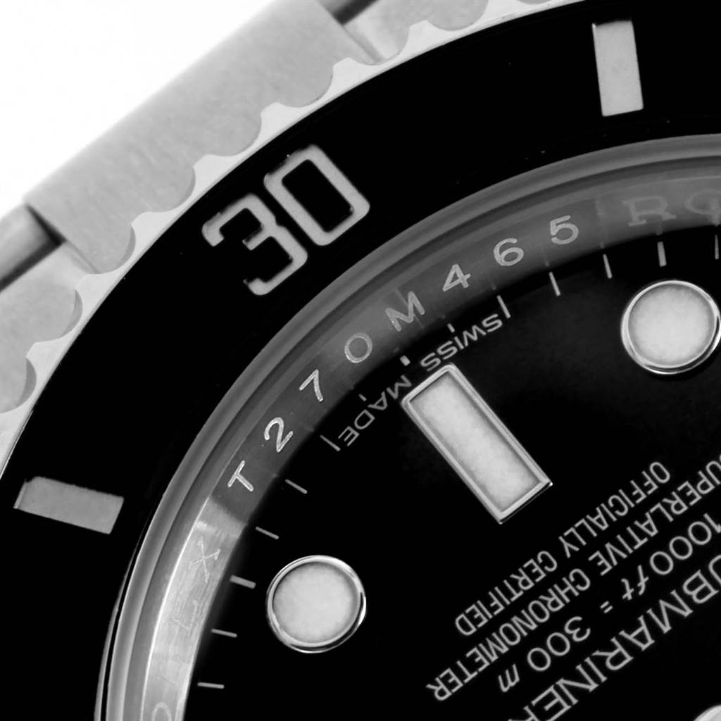 The image shows a close-up of the bezel and part of the dial of a Rolex Submariner 114060 Men's Stainless Steel Black Dial 114060 Men's Stainless Steel Black Dial watch, focusing on the 30-minute mark.