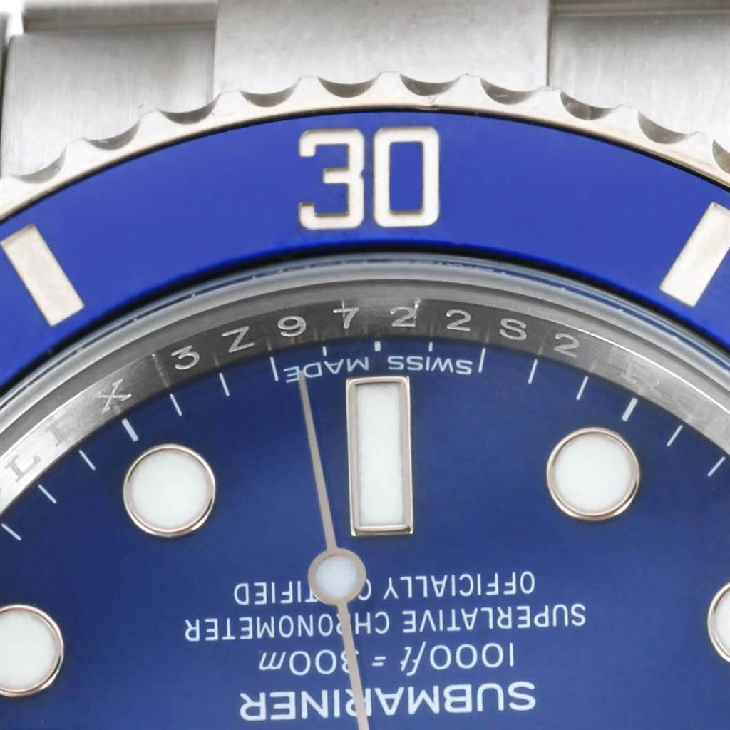 Close-up of the Rolex Submariner 116619 Men's White Gold Blue Dial 116619 Men's White Gold Blue Dial's blue dial, date window, and part of the bezel with the "30" marker visible.