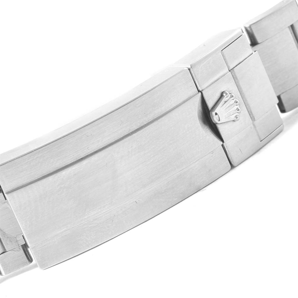 The image shows the clasp of a Rolex Submariner 116610LV Men's Stainless Steel Green Dial 116610LV Men's Stainless Steel Green Dial bracelet, featuring the Rolex logo in a partially closed position.
