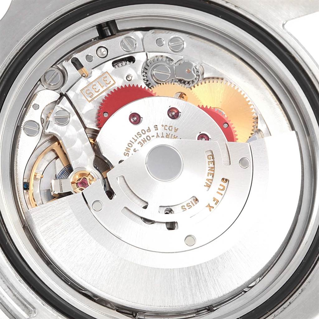 The image shows a close-up of the internal movement mechanism of a Rolex Submariner 116610 Men's Stainless Steel Black Dial 116610 Men's Stainless Steel Black Dial.