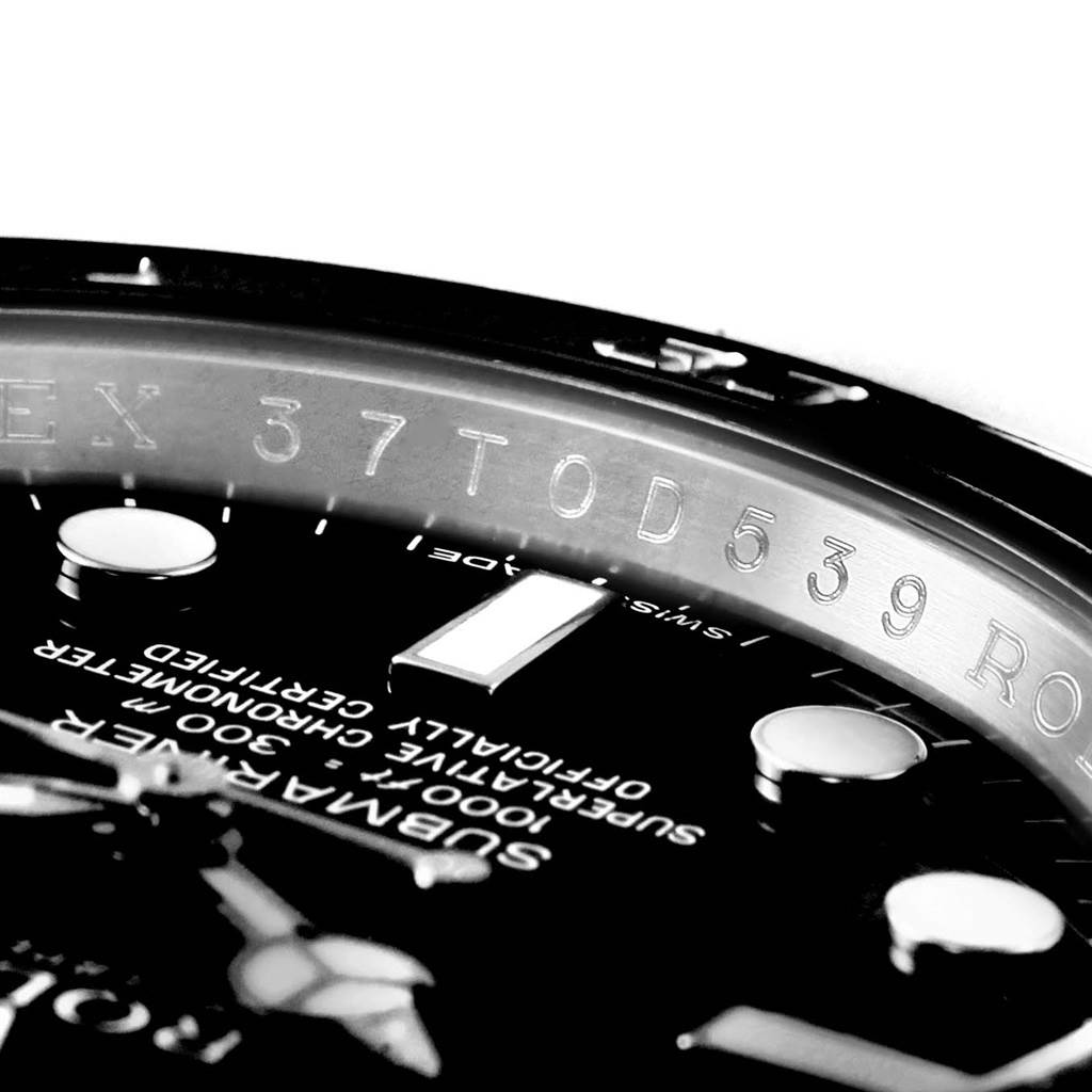 The image shows a close-up angle of the watch dial, bezel, and engraved details of a Rolex Submariner 116610 Men's Stainless Steel Black Dial 116610 Men's Stainless Steel Black Dial model.